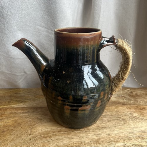 Pottery pitcher vessel hand - pottery,