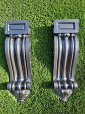 original cast iron corbels for a fireplace or to use with a shelf.