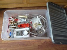 Home wine making, bit and bobs in a large plastic box (corker, natural corks)