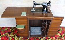 Vintage Treadle Singer Sewing Machine made in 1948. Inside a Wooden Cabinet