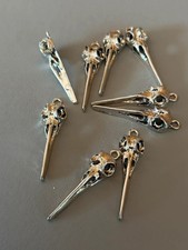 9 x  Bird skull pendants