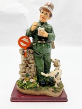 VINTAGE POLICEMAN FIGURINE