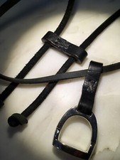 Stainless Steel Stirrup Pendant With A Genuine Leather Mount, Enclosure And Lace