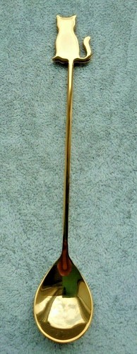 Cat topped metal stirring - topped,