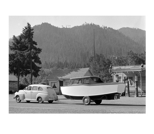 1942 car towing boat trailer - car,