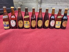 TEN VINTAGE MINIATURE BOTTLES, 7 GUINNESS AND 3 HARP.