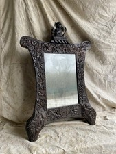 An unusual antique Edwardian carved oak heraldic lion mirror