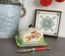 A brightly coloured handpainted novelty butter dish of foxhunting interest.