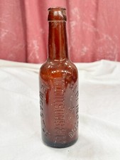 VINTAGE BEDLINGTON WOOD AND SON BROWN GLASS NEWCASTLE ALE BOTTLE