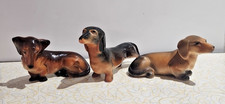 Three Vintage Brown Dachshunds