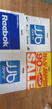 4 large sports themed used plastic carrier bags