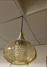 A space age 1970s Retro amber colour  light fitment with a inner mottled class