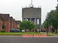 PHOTO  WATER TOWER WATTON LOOMING OVER THE HOUSES OF THE OLD RAF BASE. 2013