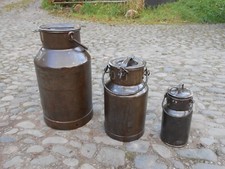 THREE ANTIQUE RUSTIC MILK