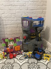 Imaginext DC Batman Bat cave and jokers fun house With vehicles and figures