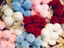 10 handmade wool pom poms. 