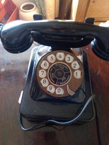 Black antique phone pre - , owned