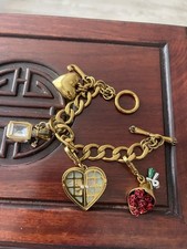 Juicy Couture gold charm bracelet with RARE, HARD TO FIND Charms.