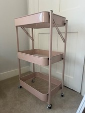 pink three tiered trolley for