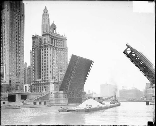 Barge sailing beneath - the, open