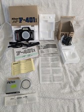 Nikon F-401X camera,  50 mm f/1.8 lens and  Toshiba filter in original packaging
