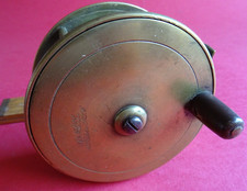 AN ANTIQUE 4" HEAVY BRASS ARMY & NAVY SALMON FLY REEL