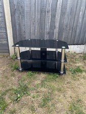 Black glass tv trolley.3 shelves to arrange DVD players and media unit.