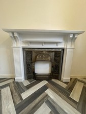 Solid Wooden Fire Surround and Cast Metal Decorative InsertFireside Fireplace