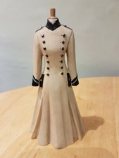 Very cute ornament of a Victorian style coat on a tailor's dummy