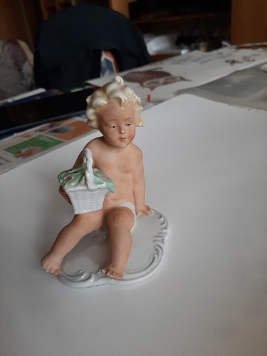 Porcelain figurine child with - porcelain,