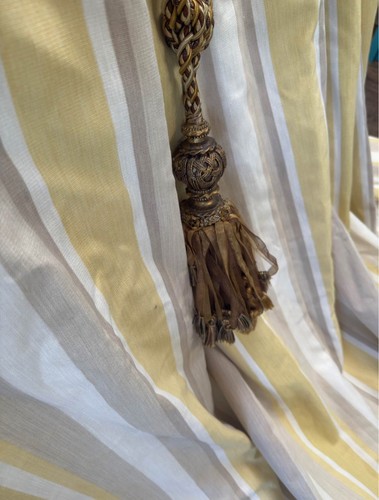 Very wide curtains gathered - , to