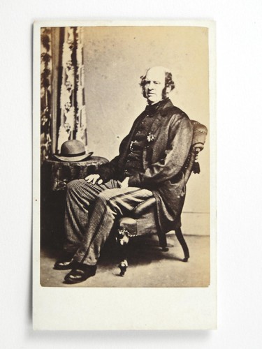 Older man seated - older,