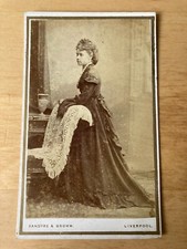 CDV:  Lady resting on chair