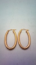 Hallmarked 9 ct Gold Oval Textured Earrings.