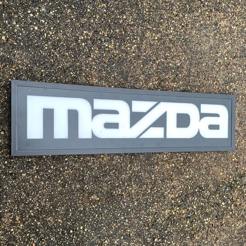 Mazda light sign badge - light,