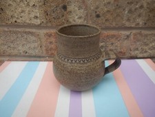 BROWN POTTERY MUG BARREL SHAPED BOTTOM SIGNED