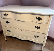 Bow fronted bedroom chest of drawers on original brass castors.  Lovely Item.