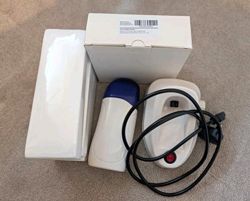 Depilatory roll wax heater - on,