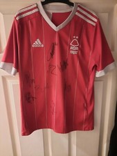 8 Signed On A Nottingham Forest Football Shirt Including Felipe, Origi, Aurier
