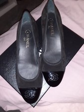 Chanel ballerina pumps, leather and suede, branding on heel of pump.  
