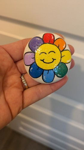 Hand painted pebble rainbow - hand,