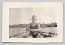 Muscular Man Sculling Rowing