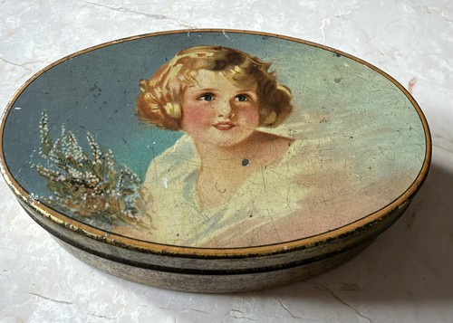 Vintage advertising oval tin