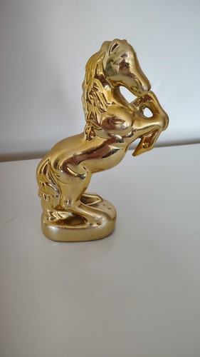 Gold covered porcelain horse - covered,