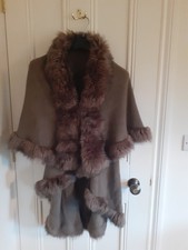 Cape  or wrap unworn brown faux fur trimmed cape. one size.