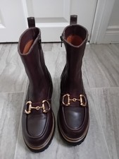 REPO, dark brown leather, and calf length boots Size 36 horse bit  pls read
