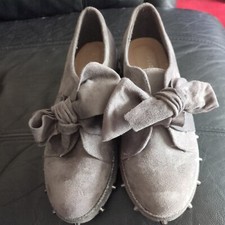 Gray Shoes With Stud Sides And A Bow