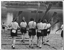 Women's rowing crew carry