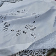 Striking vintage tablecloth, bobbin lace edging and intricate detail, 42"