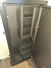 Police approved gun cabinet with ammo safe and shelving.